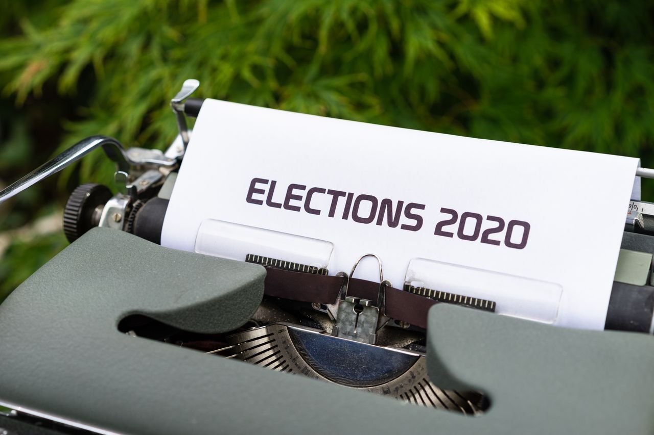 Close-up of a typewriter typing 'Elections 2020' outdoors.